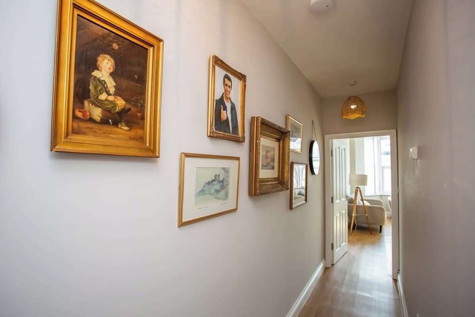 Whether you're admiring the artwork or simply taking in the sights and sounds of the sea, this hallway sets the stage for a memorable stay.