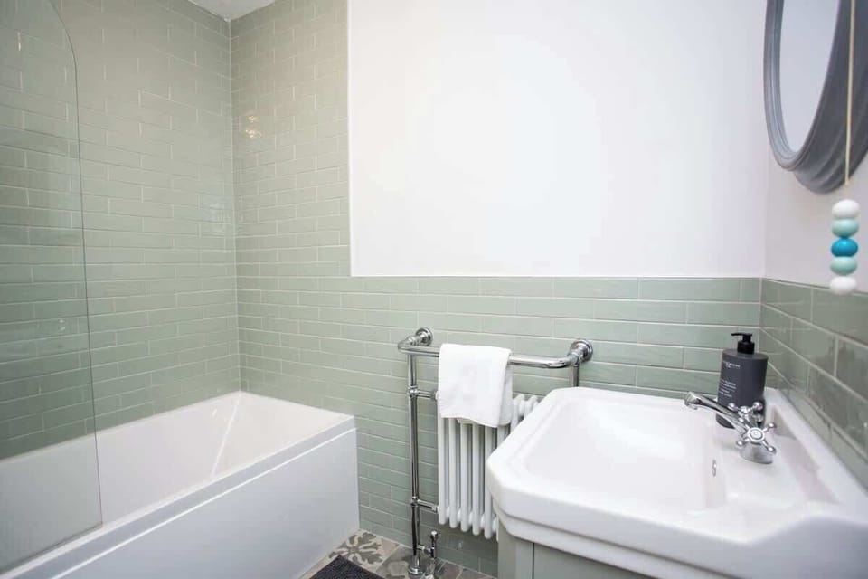 Prepare to be pampered in our luxurious bathroom oasis. From the sleek towel holder to the spacious shower and bathtub, every detail has been thoughtfully designed to enhance your comfort and convenience.