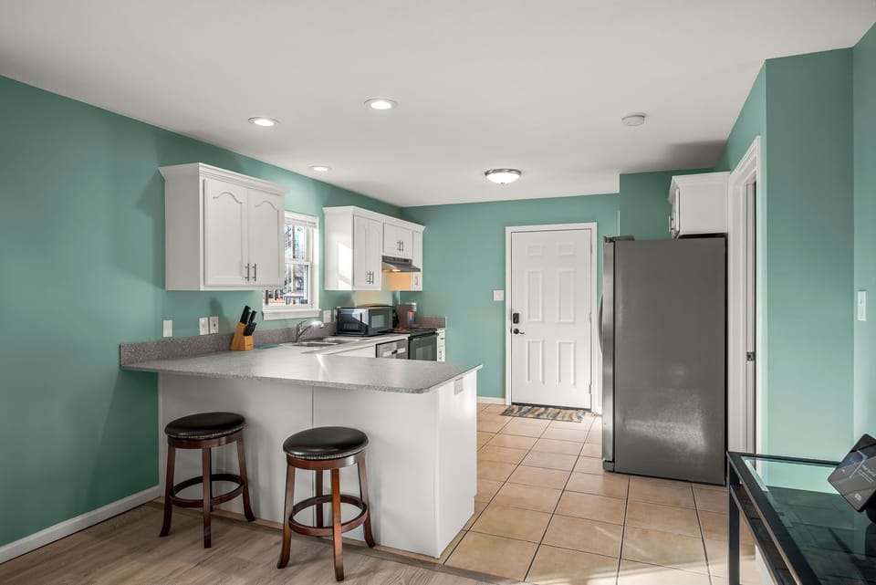 Open concept kitchen with barstools