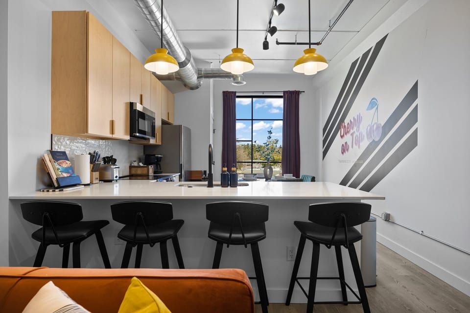 Gather to share delicious moments in this bright, artfully inspired kitchen.