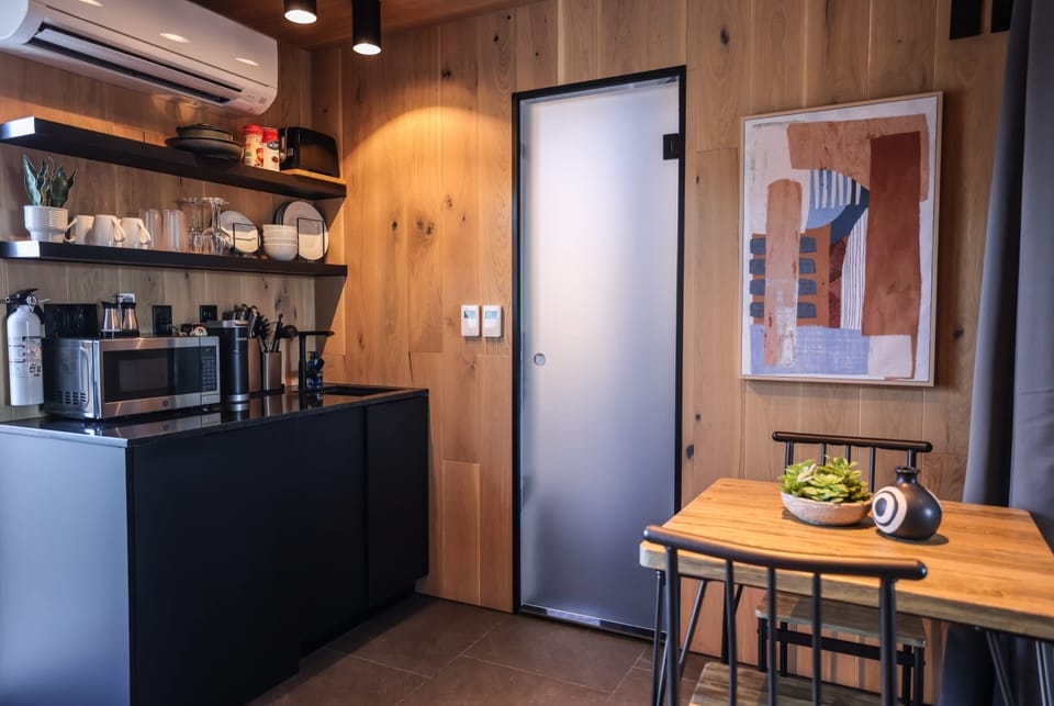 Your mirror accommodation includes a convenient kitchenette with a refrigerator, microwave, Keurig coffee maker, hot plate, toaster, kitchenware, and essentials for simple meals during your stay.