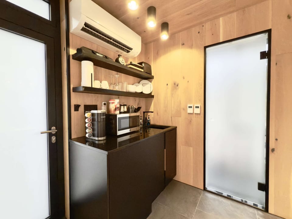 Inside our mirror homes your kitchenette includes a fridge, microwave, keurig coffee maker and kitchenware.