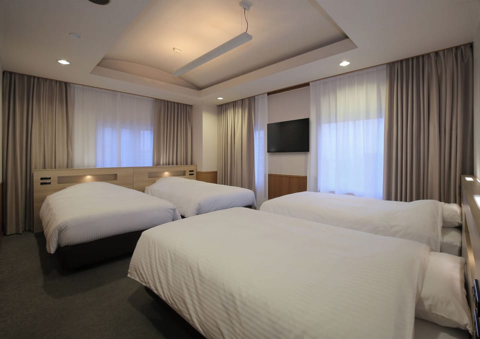 Family Room | Down comforters, desk, free WiFi, bed sheets