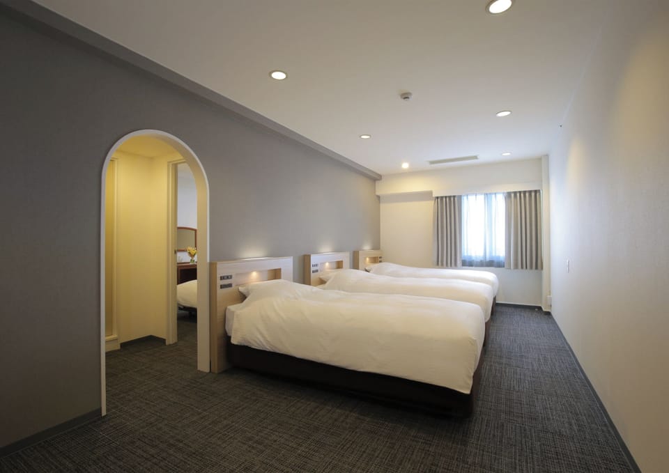 Family Room | Down comforters, desk, free WiFi, bed sheets