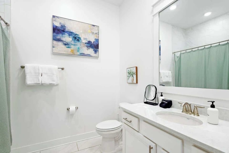 Second floor bathroom features a shower/tub combo.