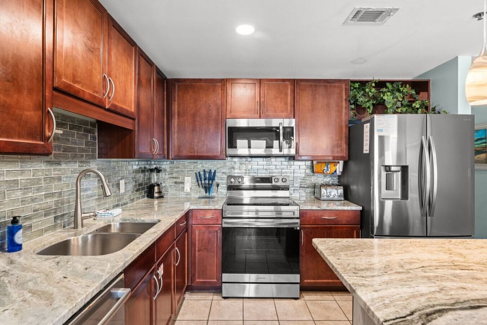 Ocean View Kitchen with Dual Coffee Maker, Stainless Steel Appliances and Island Bar Seating
