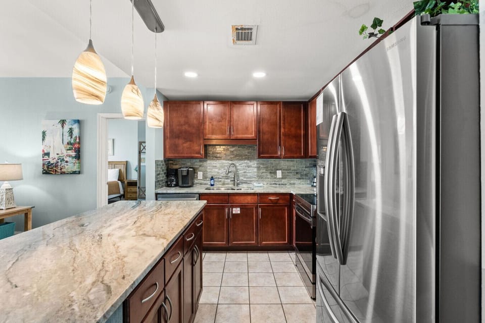 Ocean View Kitchen with Dual Coffee Maker, Stainless Steel Appliances and Island Bar Seating