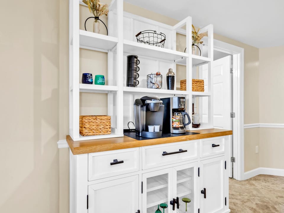 Your own coffee station awaits with everything needed for that perfect morning brew and cozy storage for all your essentials.