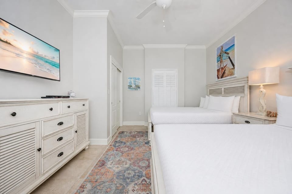Unwind in this queen guest suite and stream your favorite shows or enjoy a good movie after a beach day