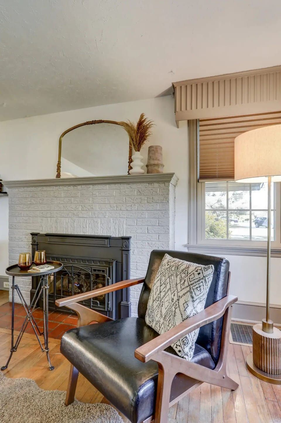 living room chairs next to the remote controlled gas fireplace