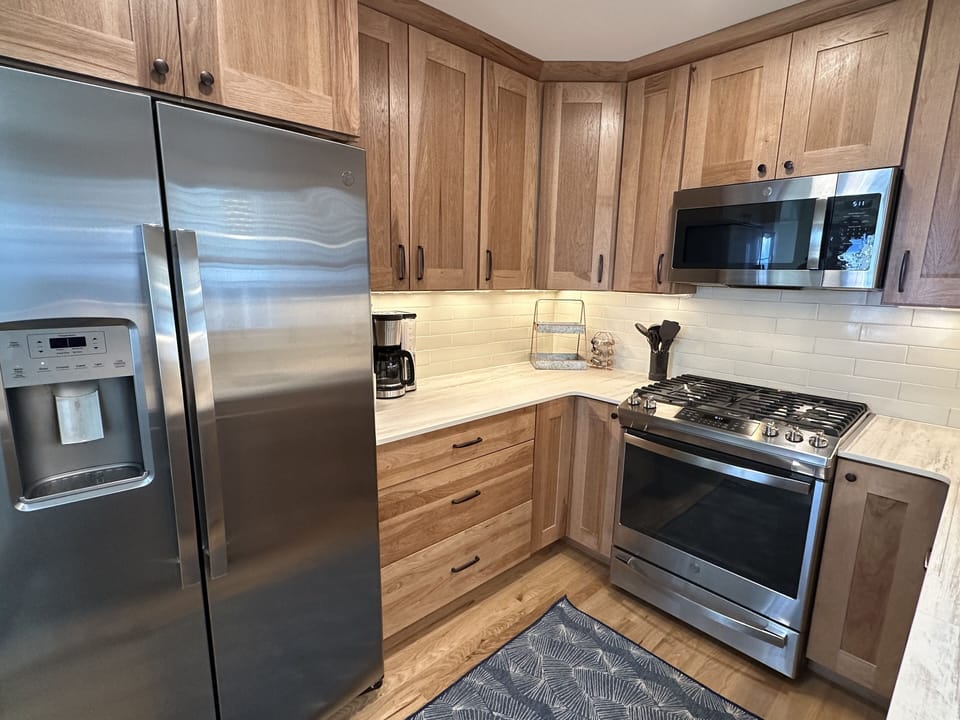 New, VERY well stocked kitchen.