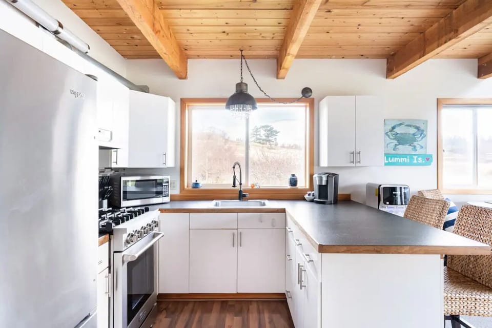 Well stocked and compact kitchen thoughtfully arranged.