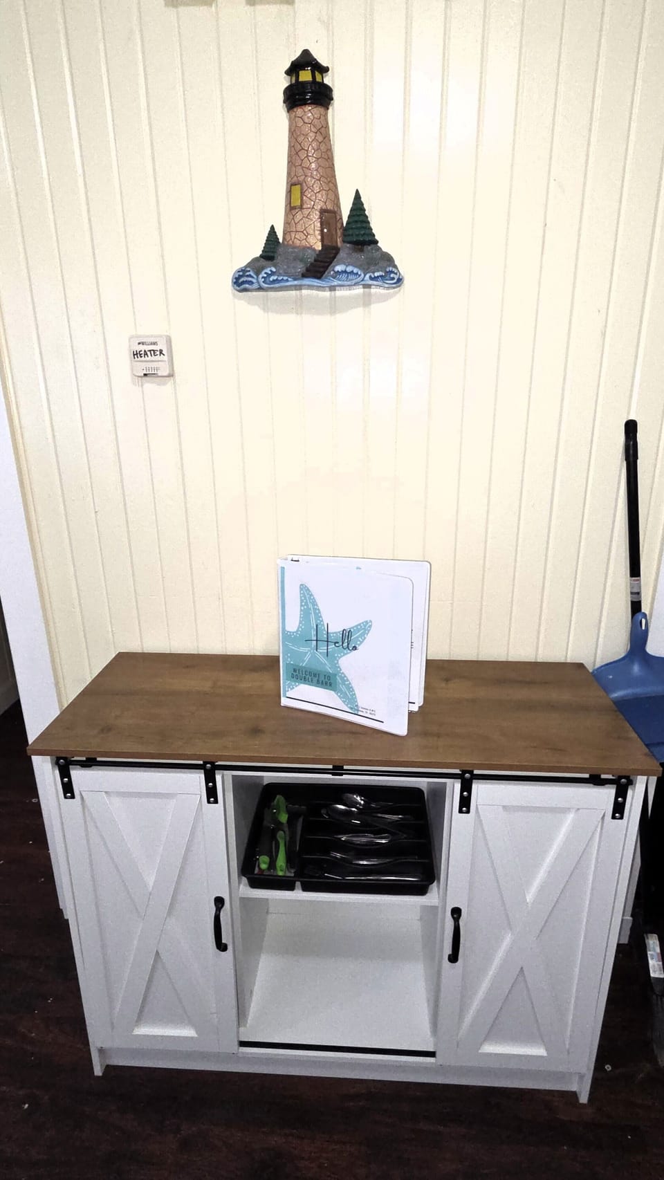 The kitchen has a cart for additional storage.