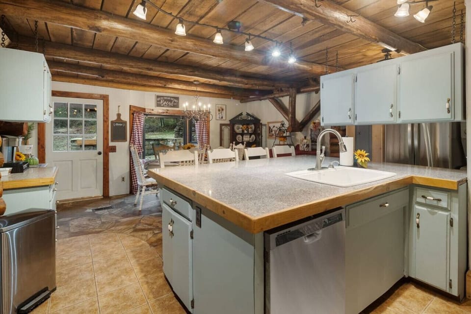 Cool kitchen with eating bar and dining table.