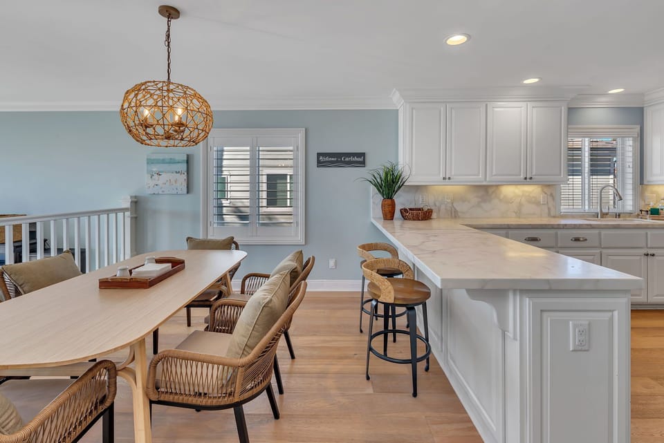 Enjoy meals at the dining area with seating for six, conveniently connected to the kitchen. Please note the home has multiple stairs and no safety gates.