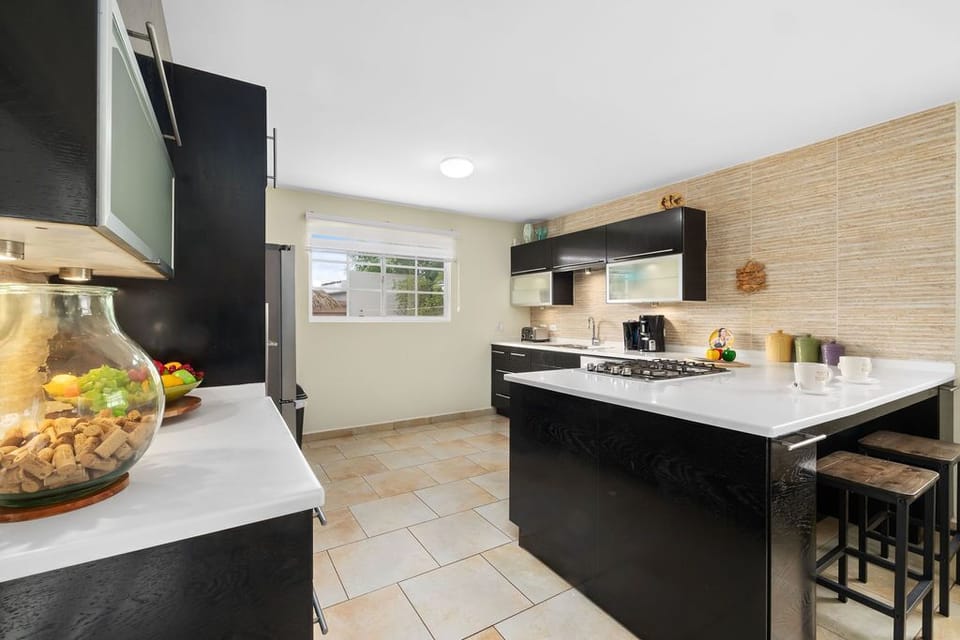 Discover the joy of cooking in our modern kitchen, where every detail is crafted for your culinary delight.