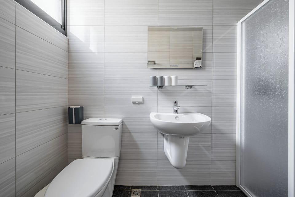Standard Quadruple Room | Bathroom | Shower, hair dryer, slippers, towels