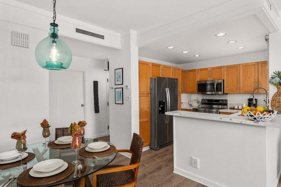 Stay in a modern condo with a stylish kitchen and cozy dining area.