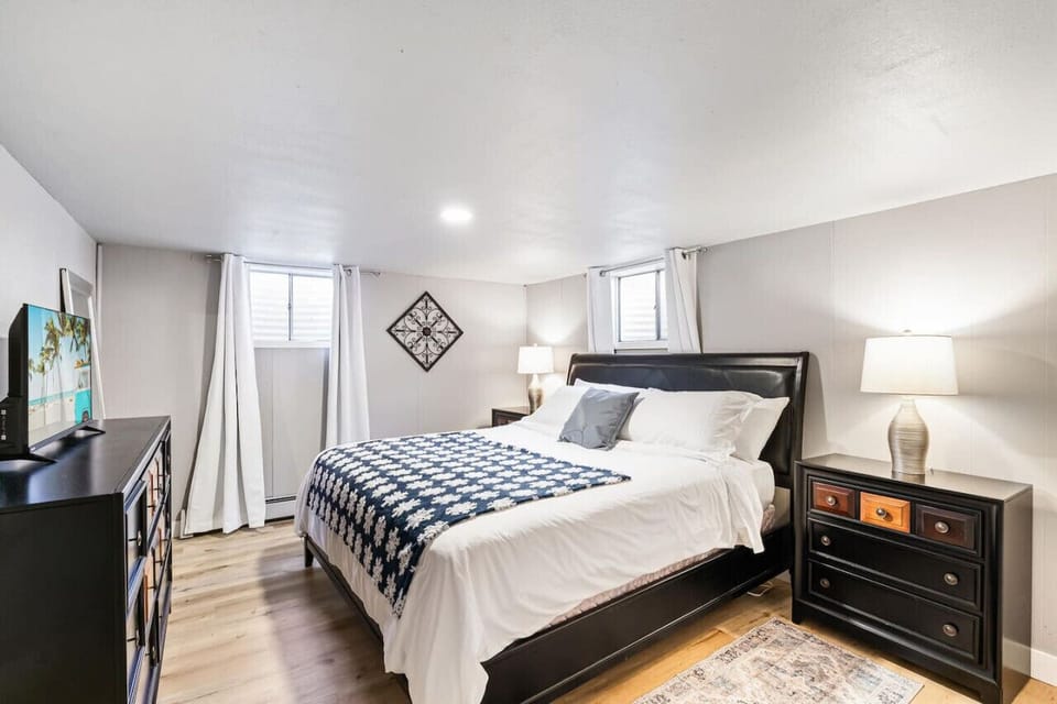 Comfortable King bed with Smart TV and room darkening curtains
