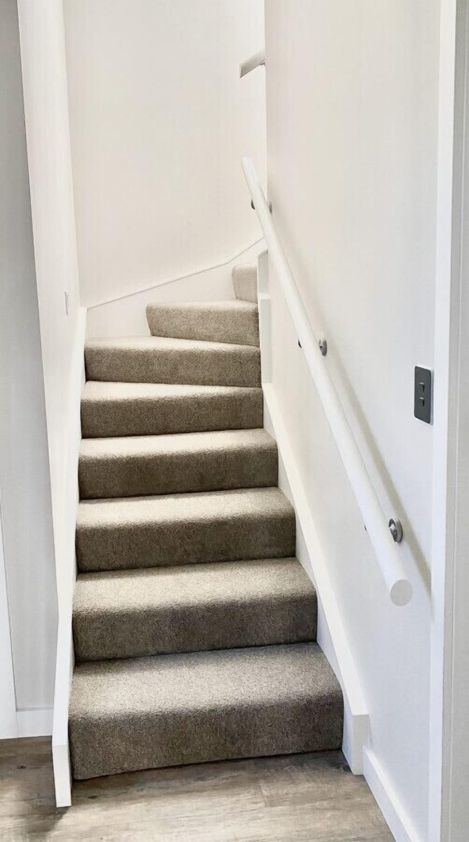 Stairs from the shared laundry to the Loft Hideaway