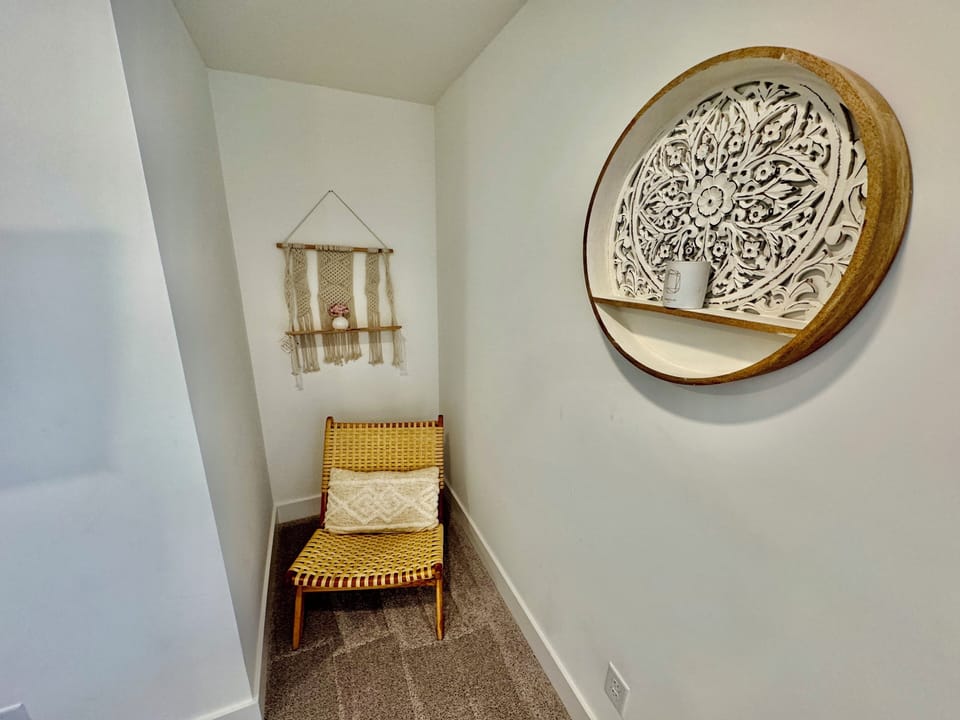 MASTER BEDROOM READING NOOK -  features a reading nook, balcony and attached bathroom with double sink and large shower.