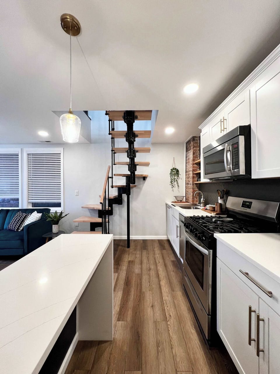 The waterfall peninsula and spiral staircase were extra splurges that paid off in the overall design. 