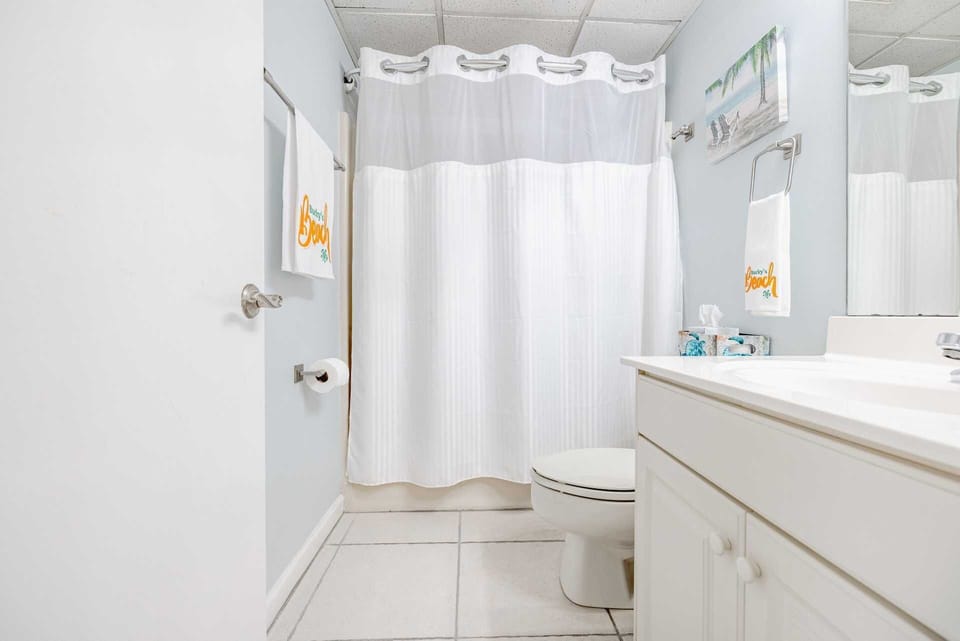 Downstairs bathroom with tub and shower