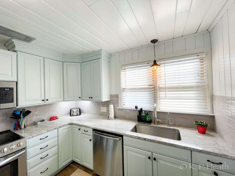 New cabinets, granite counters, and stainless appliances.