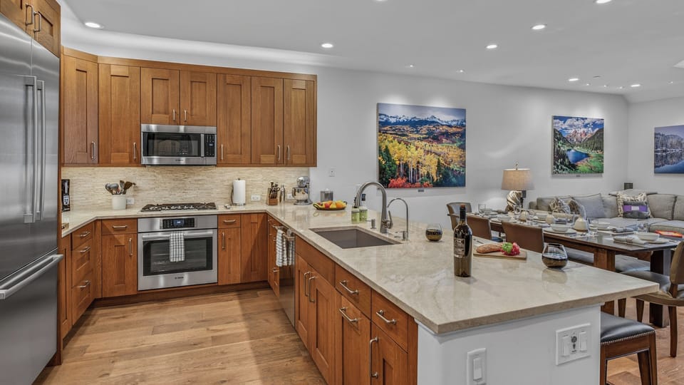 Kitchen, Main Level - Island with sink and wood cabinetry