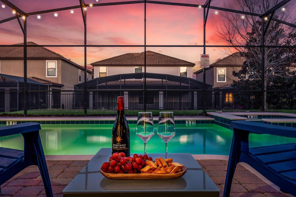 Evening pool scene w/ glowing water and a peaceful nighttime vibe.