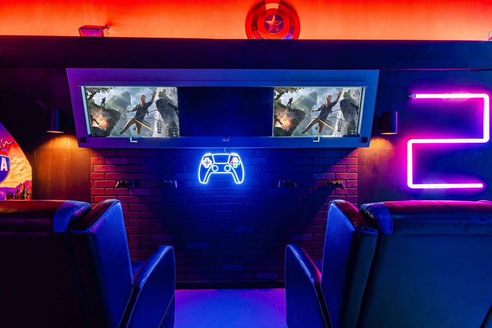 Neon-lit arcade room w/ immersive screens and seating for high-energy game nights.