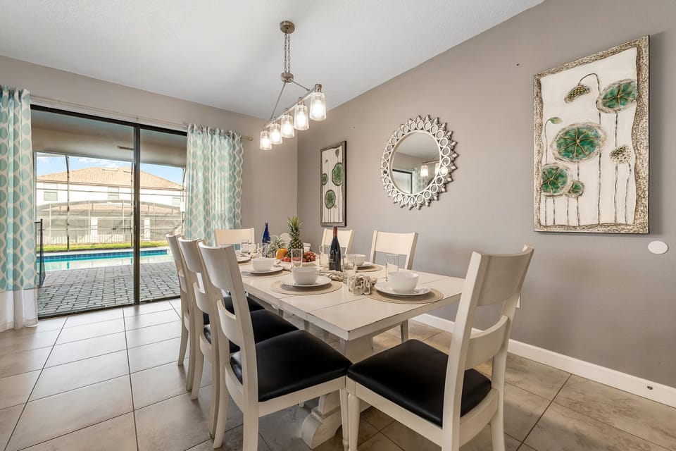 Bright dining nook set by large windows for relaxed meals and conversation.