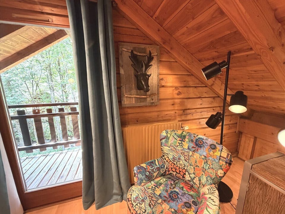 Bedroom with double bed and TV