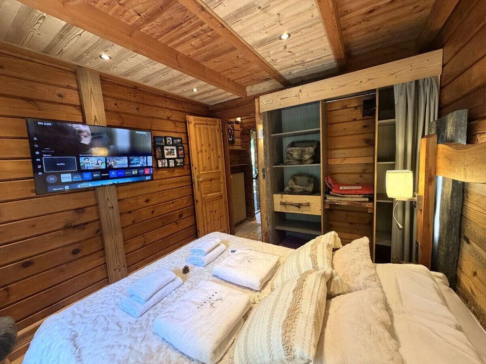 Bedroom with double bed and TV