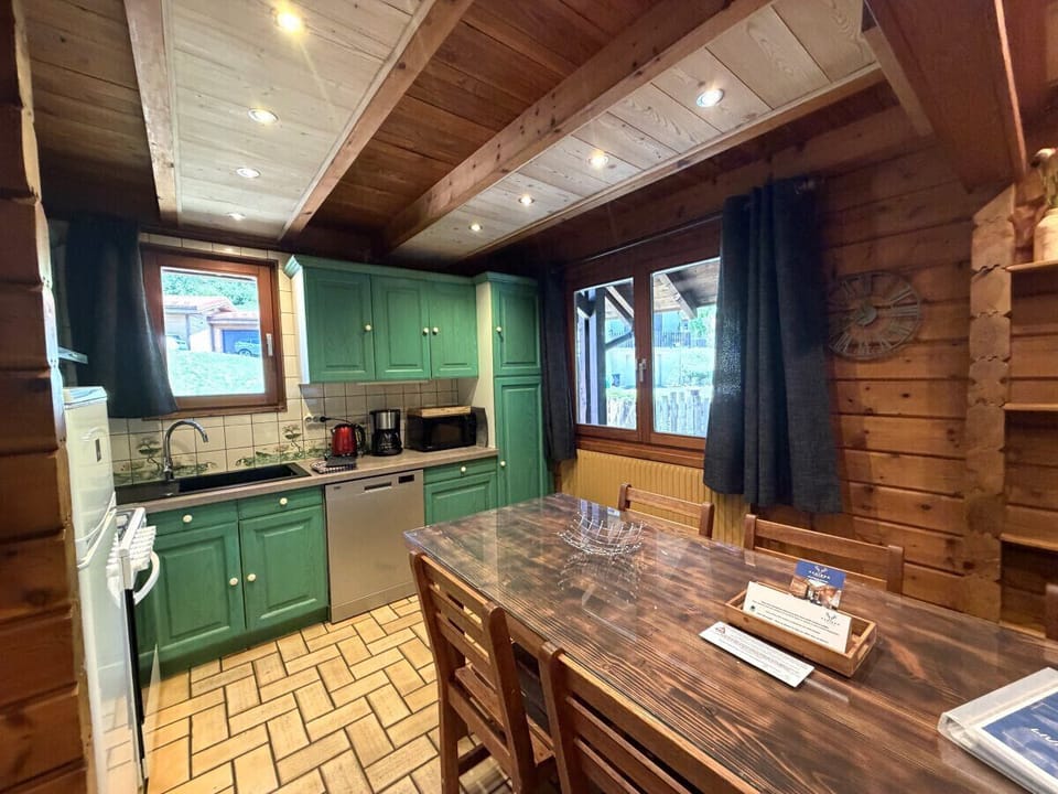 Kitchen with fridge, stove, microwave, coffee maker, kettle, dishwasher, washing machine