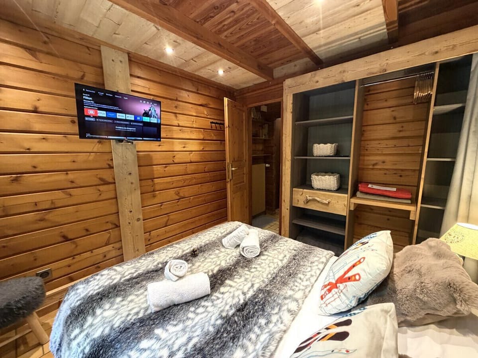 Bedroom with double bed and TV
