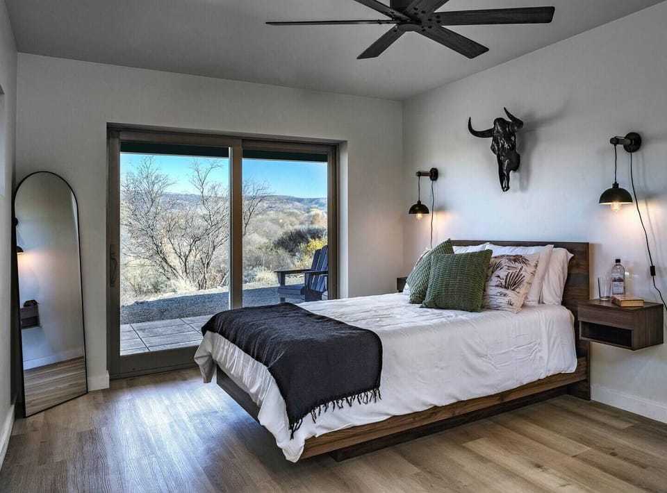 The Master Bedroom, or 'The Bear Mountain Room,' is a tribute to the iconic Sedona trail and mountain. Step through the patio doors to your private outdoor haven, where the sights and sounds of Oak Creek, House Mountain, and century-old Cottonwoods.
