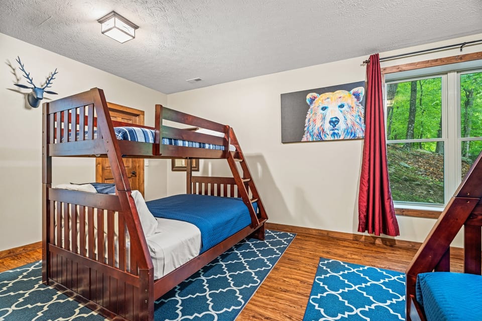 The bunkroom features two sets of bunks (fulls on bottom, twins on top)