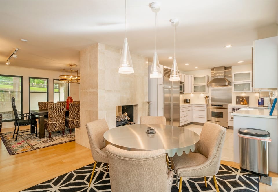 Cozy up by the fireplace in our sleek dining area or start your day with a warm cup and good vibes