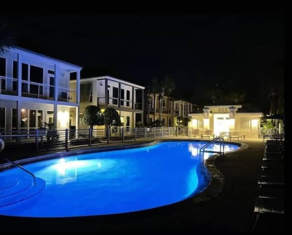 Take a dip in the heated community pool, beautifully illuminated. 
