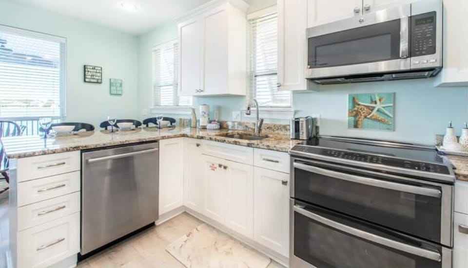 Spacious kitchen and modern appliances with plenty of counter space. 