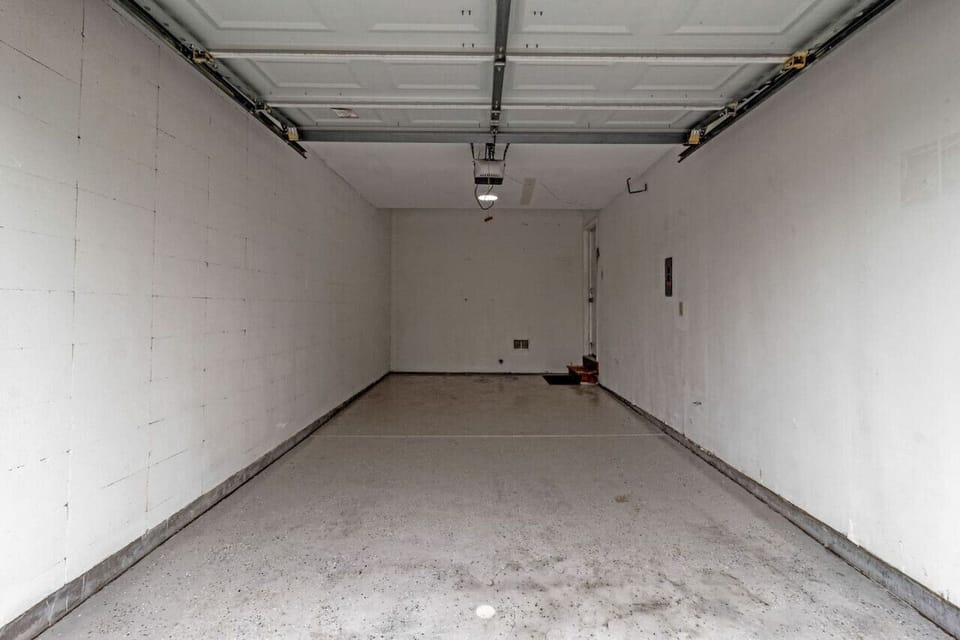 ATTACHED one car garage with automatic opener