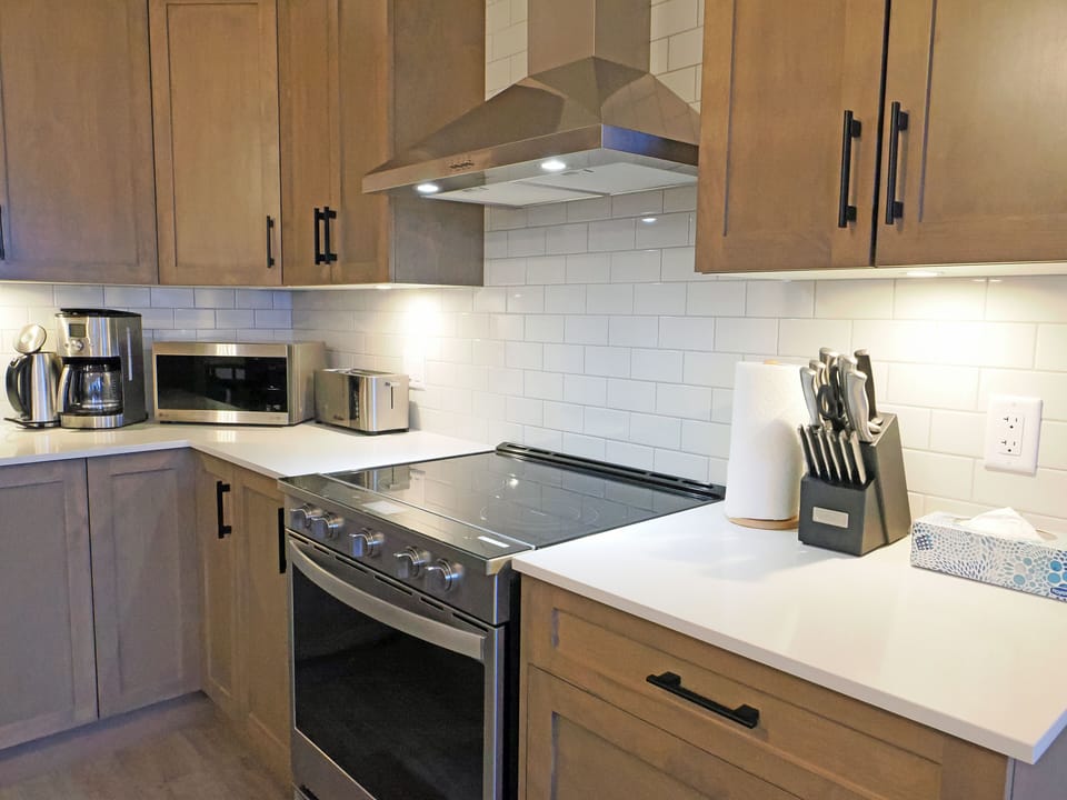 Kitchen equipped with  stainless steel appliances