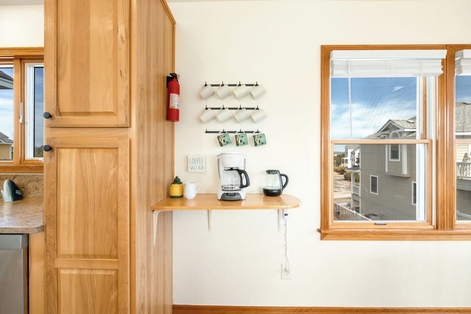 Conveniently located between the kitchen and dining space, the coffee bar provides the perfect spot to start your morning with a fresh cup!
