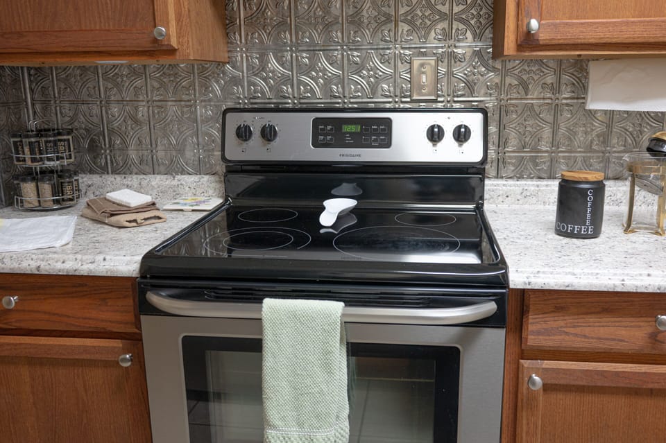 Smooth top stove with self-cleaning oven. 