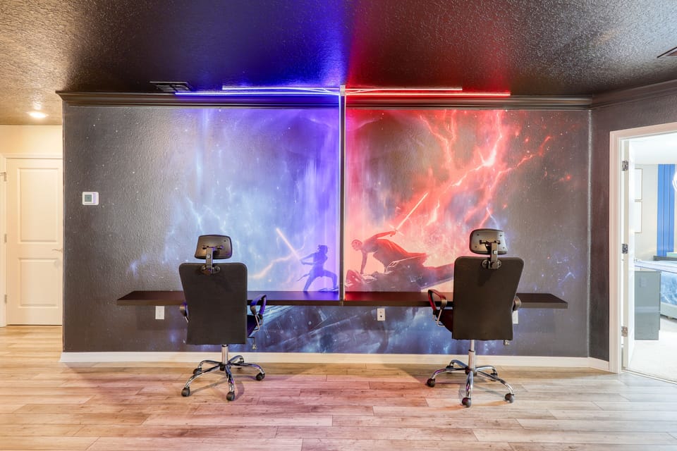 Massive flatscreen and gaming chairs.