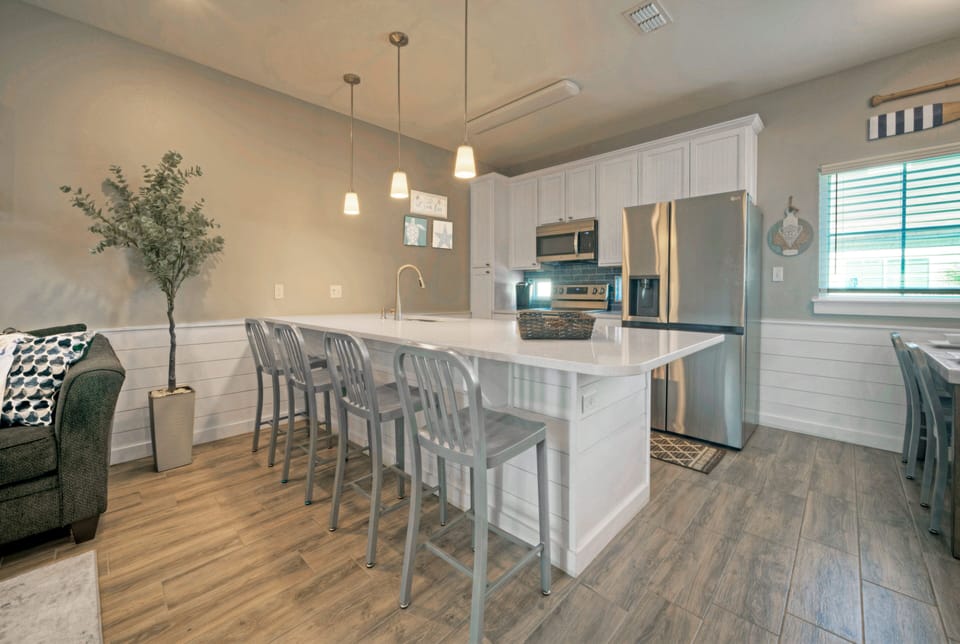 Kitchen barstools offer additional seating.
