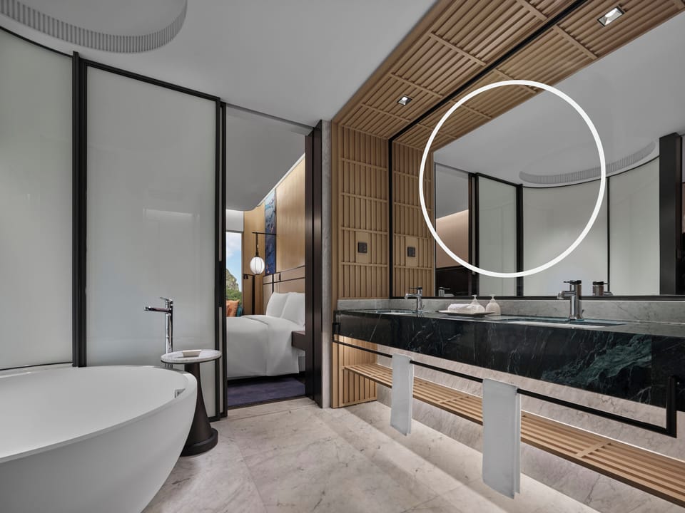 Separate tub and shower, rainfall showerhead, designer toiletries