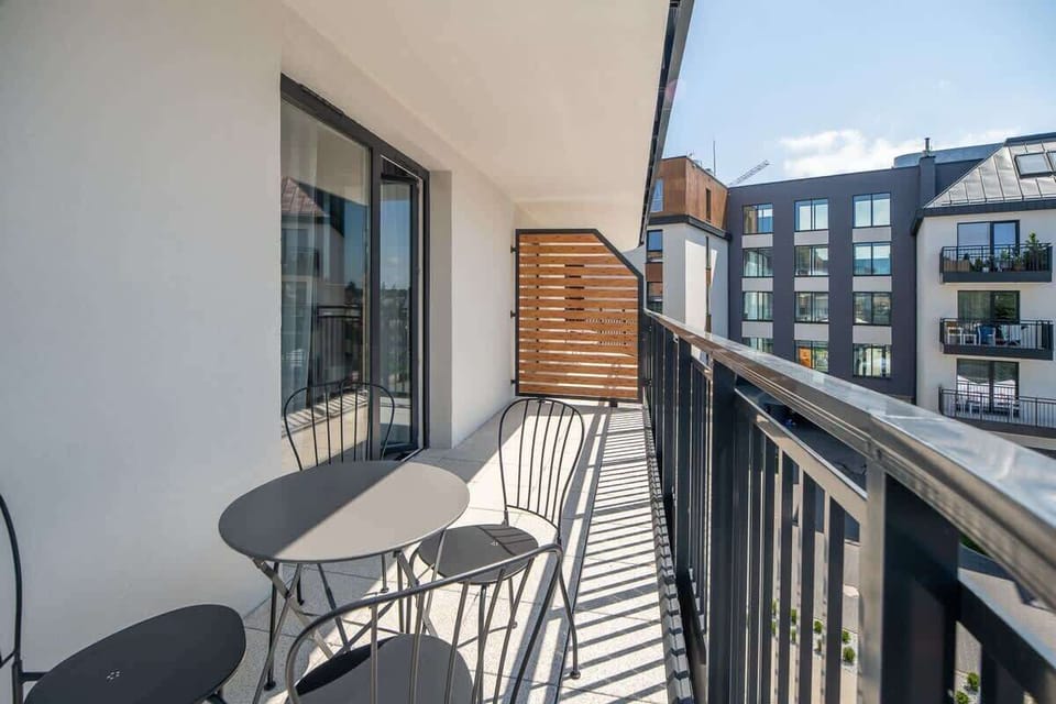 Another perspective of the balcony, showing its connection to the interior and the scenic surroundings.
