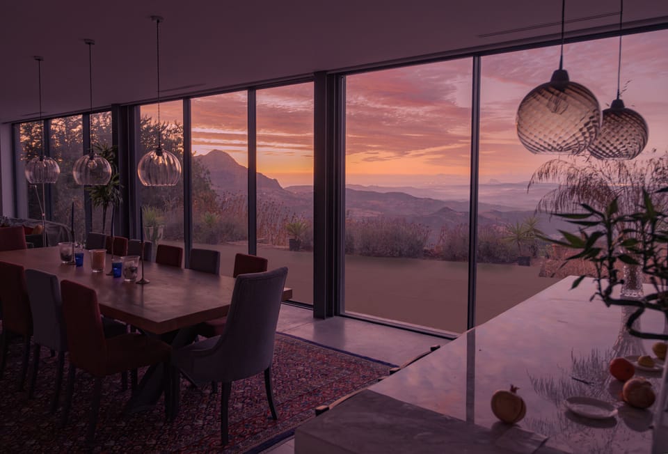 The dining table and terrace from the kitchen on a beautiful autumn morning